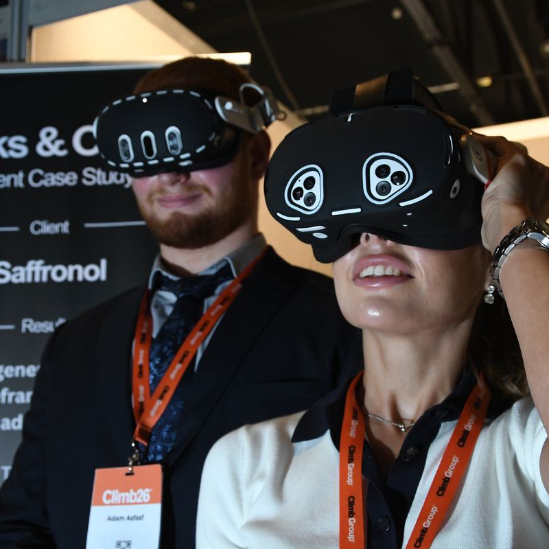 A delegate in a VR headset on the expo floor