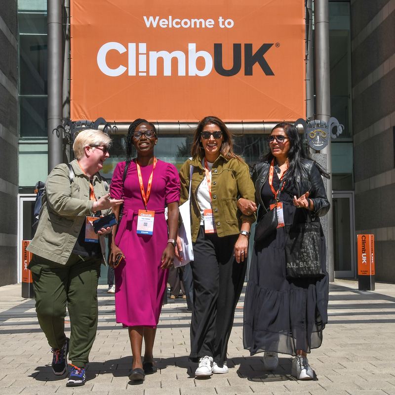 A group under the Welcome to ClimbUK sign